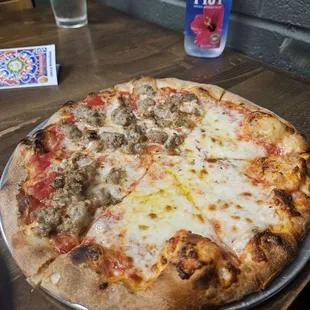Half cheese, half sausage pizza