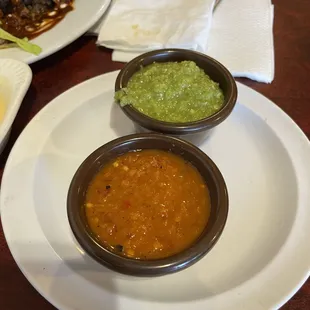 Make sure to ask for these...Red is Pineapple based (HOT) Green is Tomatillo based.