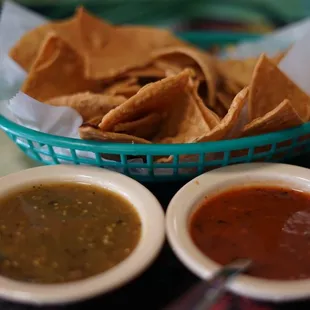 two bowls of salsa and tortillas