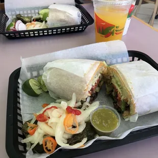 Torta tejana, jalapeños, onion w/habaneros, limes, salsa, agua de mango and horchata