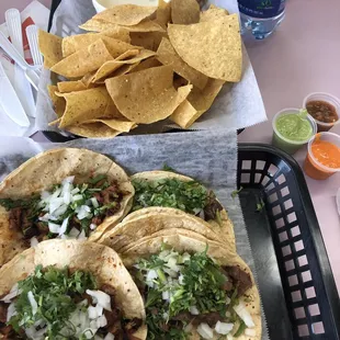 Queso with lengua and pastor tacos