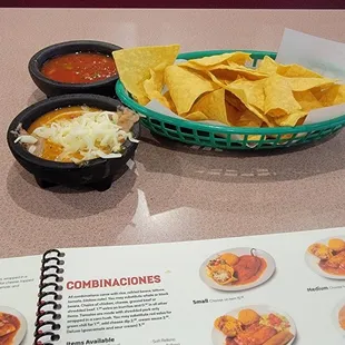 Complimentary chips and refried beans with cheese, delicious