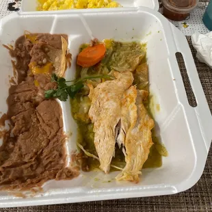 Nasty beans,chicken,chips,carrot(lol),green sauce,eggs