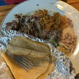 Solid carnitas with corn tortilla.
