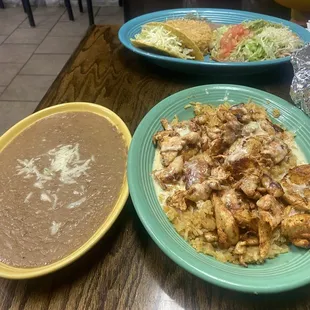 Pollo Feliz with a side of refried beans