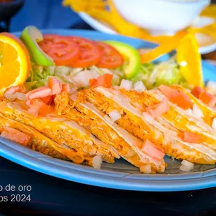 Quesadilla Large Flour Tortilla stuffed with Melted Cheese. Served with Sour Cream, Fresh Tomatoes &amp; Green Onions. Chicken or Beef