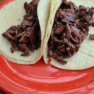 Carne asada tacos. The Cilantro and onions come on a separate plate.