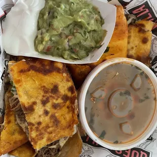 Birria Quesadillas come with sour cream and guacamole