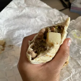 Green chile burrito with beans and beef - chunks of soft potato. So delicious!