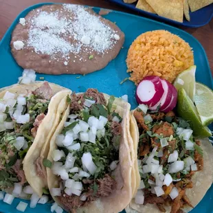 Taco combo with carnitas, birria and pastor. Delicious!