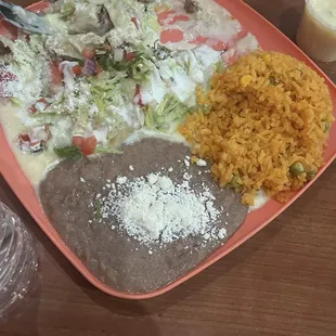 Beef enchilada with a special request of cheese sauce.