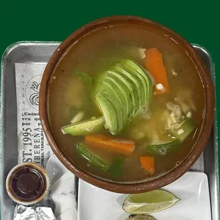 a bowl of soup and a plate of food