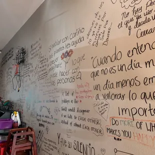 a wall with writing on it
