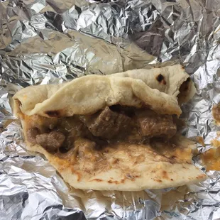 Carne guisada with cheese