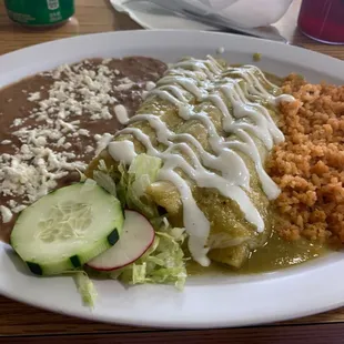 Chicken Enchilada style green comes with rice and beans