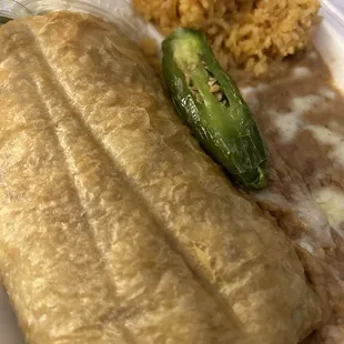 Asada chimichanga combination plate with rice and beans. Large horchai.