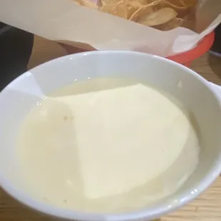 a bowl of soup and chips
