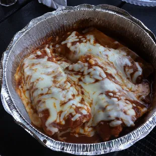 Three pork tamales with red sauce and that great cheese! Again, great! Eat rest of this tonight!