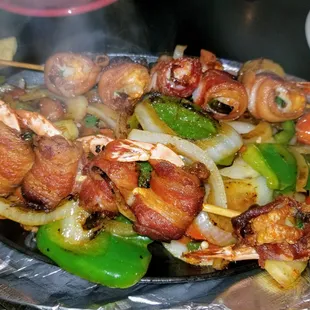 Camarones Del Pacifico.  Jalapeno, cheese, &amp; bacon-wrapped shrimp, served over grilled vegetables.