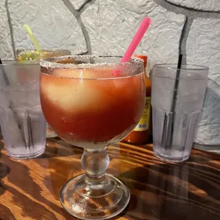 a drink in a glass on a table