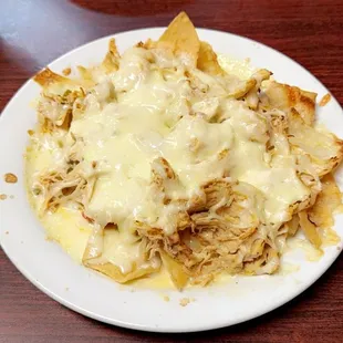 Half order of chicken nachos appetizer.