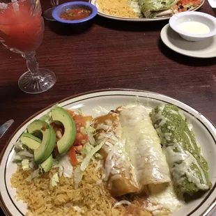 Enchiladas with avocado salad and rice
