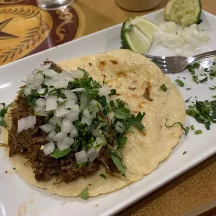barbacoa taco with lime, onion, and cilantro, red salsa came later!