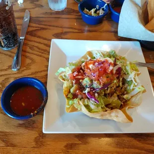 To help get an idea of scale the salsa cup is about the same size as the salad... It&apos;s more of a TOSTADA DELUXE than an actual Taco Salad