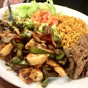 Mixed fajitas lunch special.  With rice and refried beans.