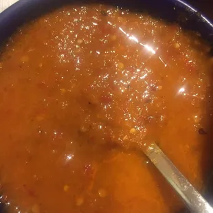 a bowl of soup with a spoon