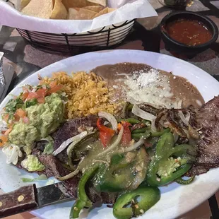Carne Asada plate with grilled onions and jalapeños