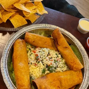 a plate of mexican food and chips