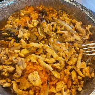 a bowl of food with a fork in it