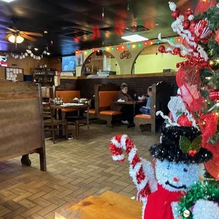 a decorated christmas tree in a restaurant