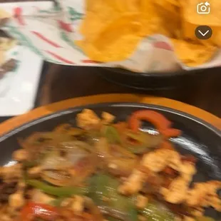 Free Fresh fried tortilla chips, chicken fajitas