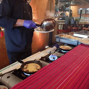 Chef cooking omlette.