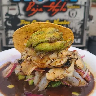 Tostadas (El Jefe). Raw Shrimp, Mexican Scollops and Sea Snail with El Jefe Famous Black Aguachile sauce