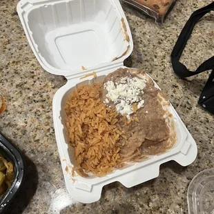 a meal in a styrofoam container
