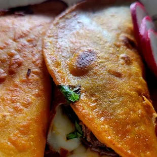 Birria tacos with cheese