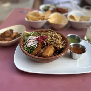 Slow Roasted Pork Carnitas Fingerling Potatoes Fried Plantains Side of Greens