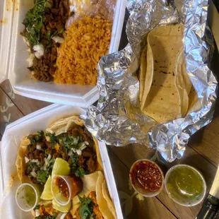 Chicken and steak tacos and carne asada plate