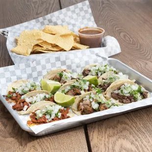 a tray of tacos and chips