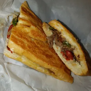 Tampa Bay cheesesteak with provolone cheese, peppers, onions