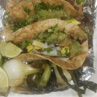 three tacos in foil
