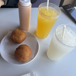 Potatoe Ball with beef Passion Fruit Juice (yellow), Jugo de guanabana (white)