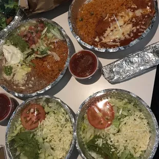 2 of 3 meals we ordered, the two salad looking dishes are JUST the lettuce, pico de gio, cheese, guac &amp; rice that came with both meals.