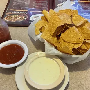 Complimentary chips and salsa plus a small cheese dip