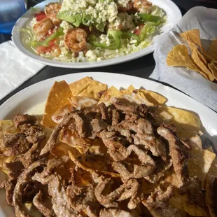 Shrimp Caesar Salad and Steak Nachos were incredibly delish and large servings