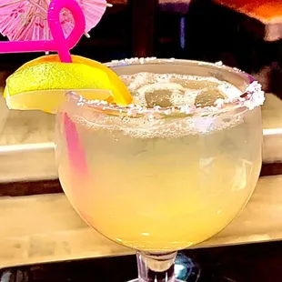 Happy hour lime marg on the rocks.. even got a lemon lime curly straw and umbrella  love this place