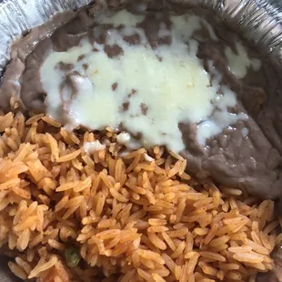 a plate of mexican food with rice and beans